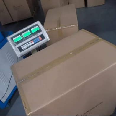 Close-up of a calibrated digital industrial platform scale showing the precise gross weight of an export master carton for 100% pre-shipment quantity verification