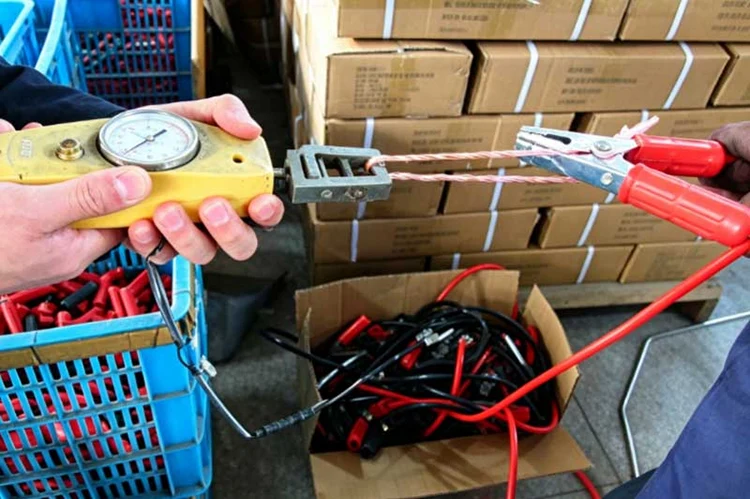 Tensile strength test for booster cable using tension gauge