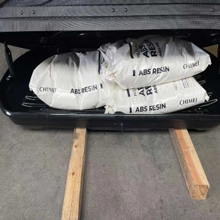 Car roof luggage box wrapped with transparent plastic film for dustproof protection before carton packing