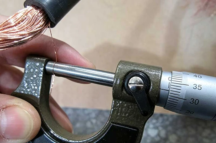 Measuring jumper cable length with tape measure